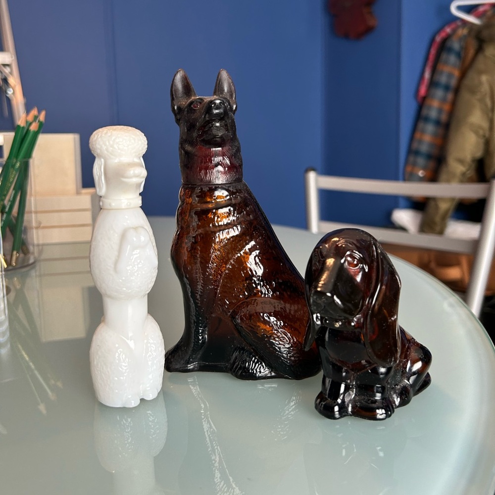 Three Vintage Avon perfume dog bottles